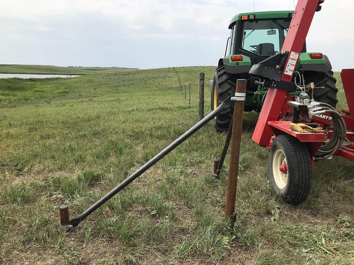 Reference: tractor-mounted post driver we use on long runs.