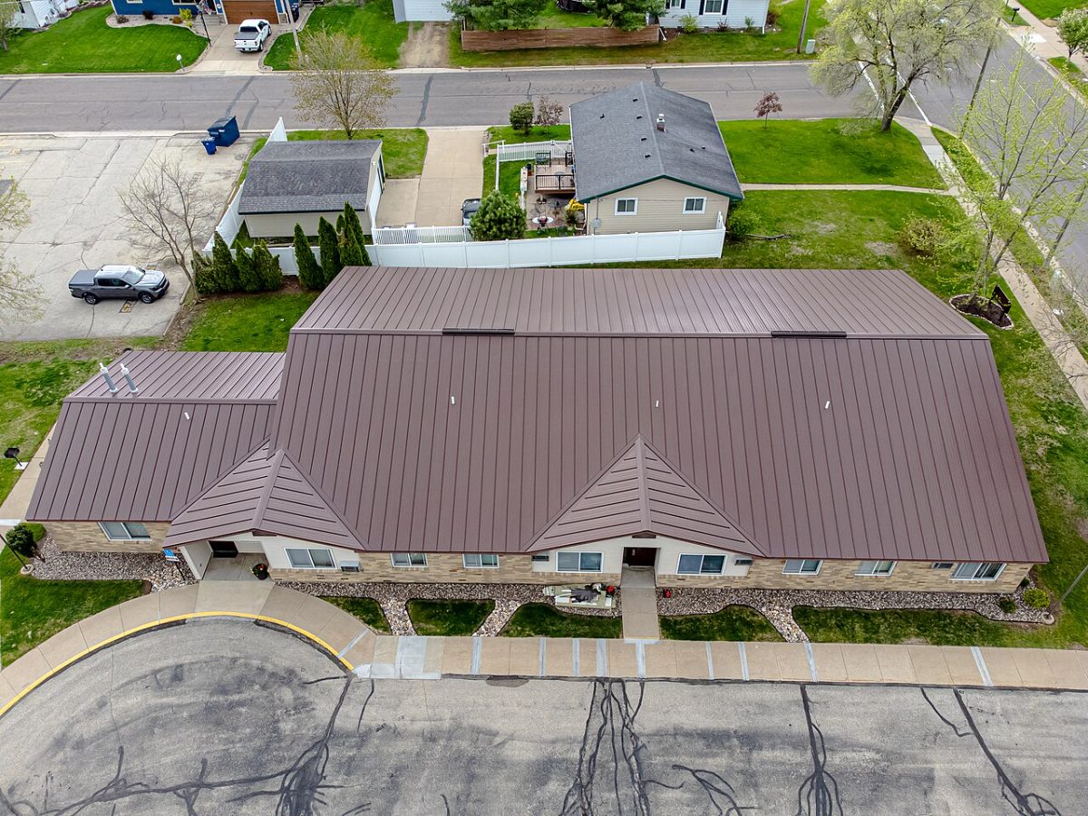 Reference: a completed commercial re-roof from the air.